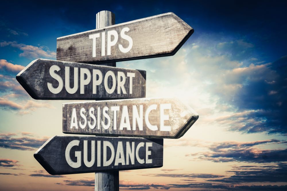 tips, guidance, support and assistance sign with arrows indicating which way to go.