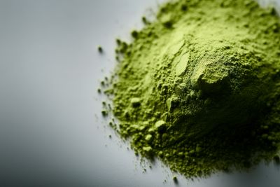 Pile of green kratom powder