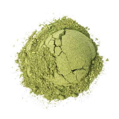 close up pile of kratom powder white background